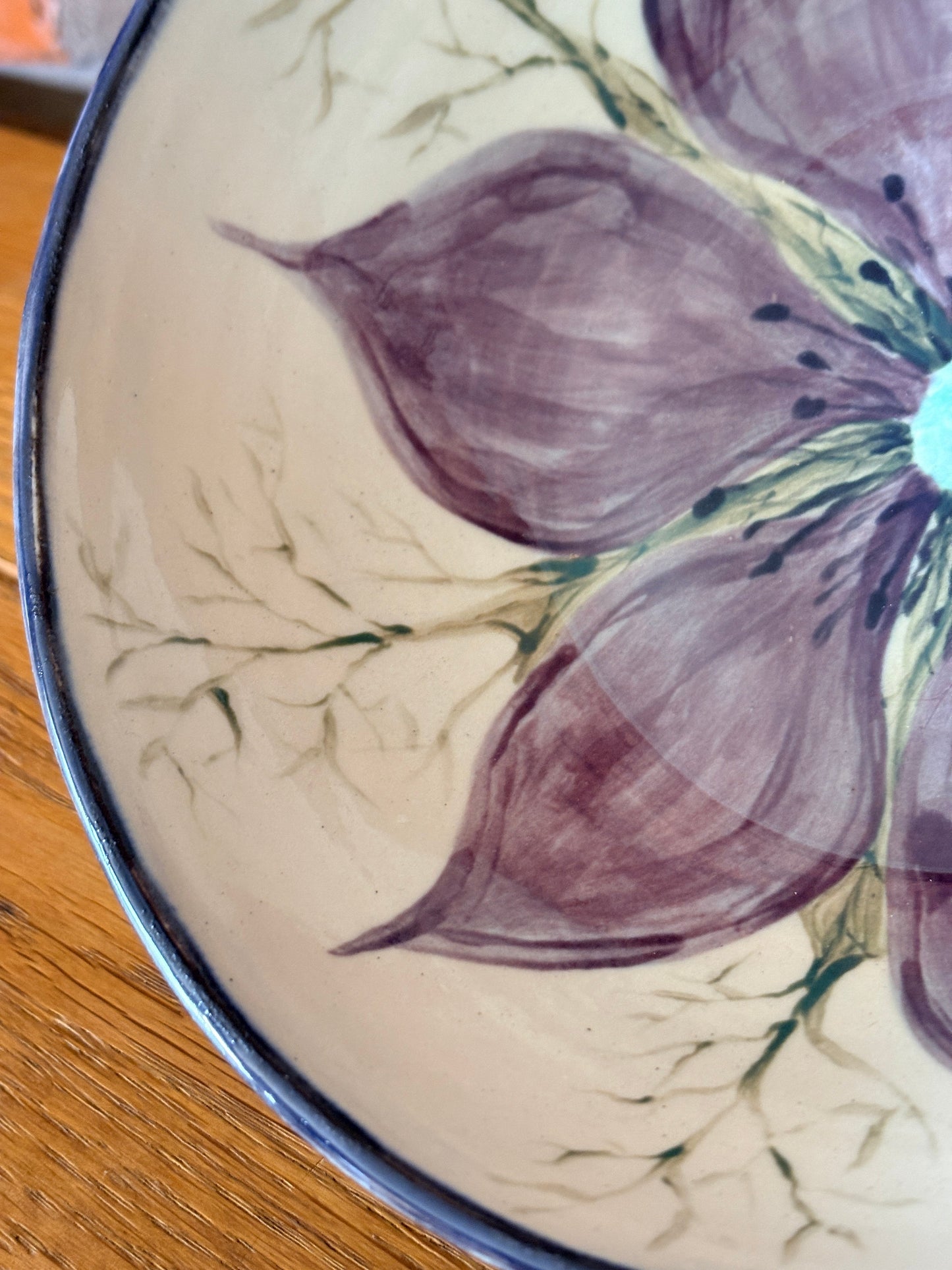 Hand‑painted ceramic bowl featuring a Love‑in‑a‑Mist flower from the Petal & Earth Collection.